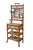 An exquisite antique Victorian bamboo étagère featuring an intricate bamboo frame paired with woven cane paneling...