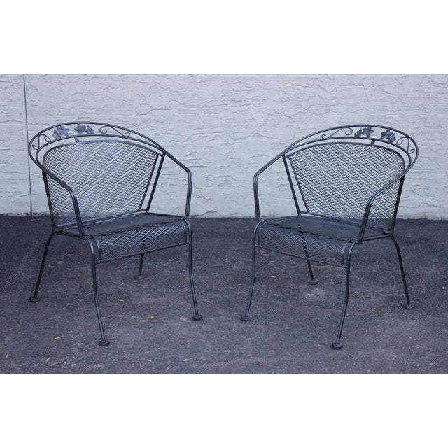 High Quality Vintage Wrought Iron Patio Armchairs Featuring Mesh Seats And Backs With Scrolled Crest Rails Accented By...