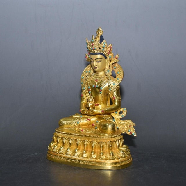 This is a finely crafted antique gilt bronze sculpture of Amitayus Buddha, the Buddha of Infinite Life, a revered figure...