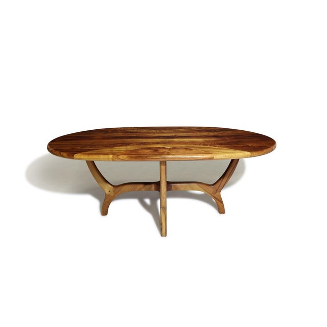 This handcrafted Koa wood dining table features curvilinearly joined planks of solid Koa, forming a flowing pattern that...