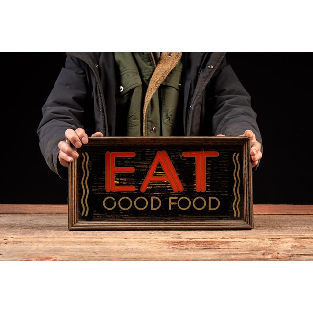 Charming countertop lighted sign featuring bold red "EAT" lettering over "GOOD FOOD" in gold, flanked by stylized steam...