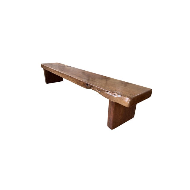 Crafted from a substantial block of solid lychee wood, this sculptural bench embodies the essence of modern organic design...