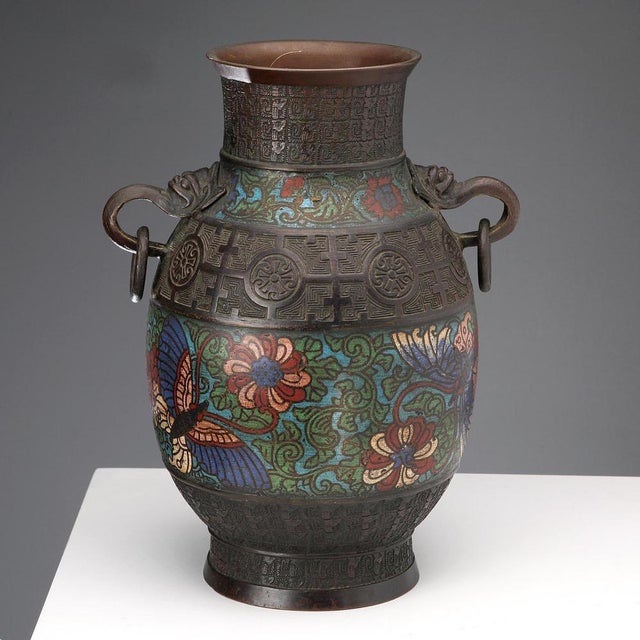 Bronze vase decorated with bands of polychrome enamel using the Shippo cloisonné technique. The upper band features a...