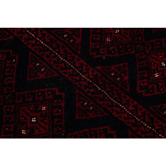 Beautiful vintage Persian Shiraz hand-knotted wool rug with a red color field. This piece has black and beige accents in...