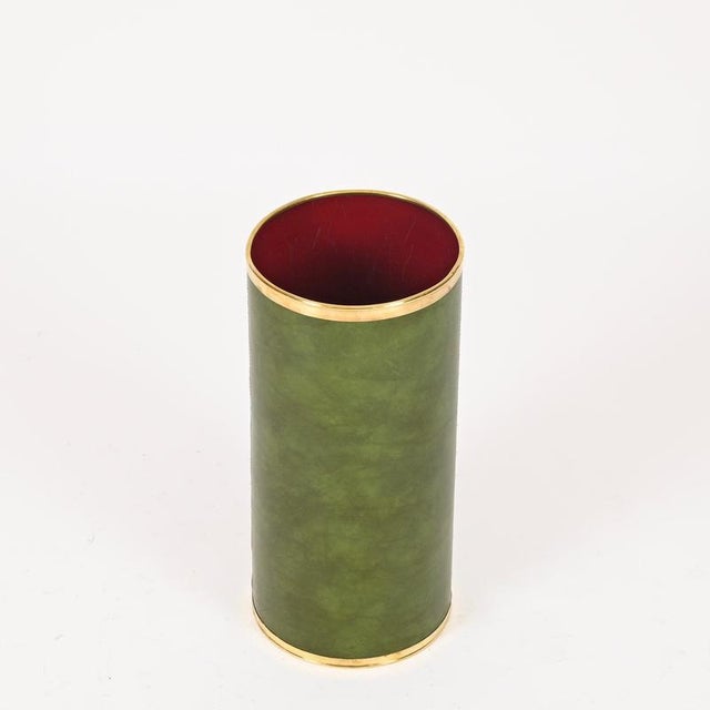 Marvelous and unique Mid-Century umbrella stand in a lovely green-toned leatherette with brass details. This incredibly...