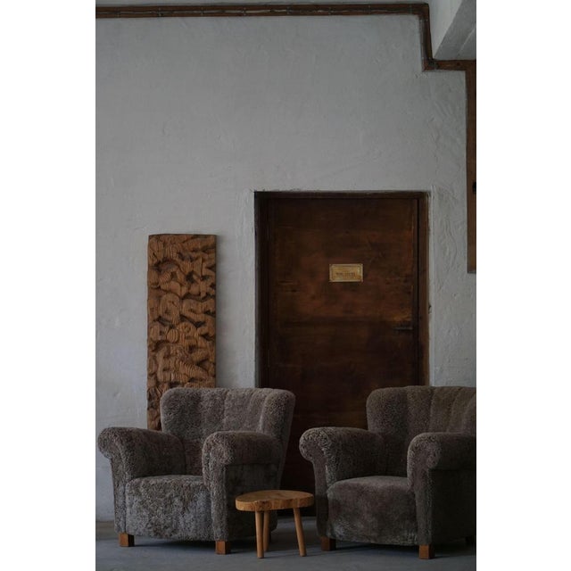 An amazing pair of Danish mid-century modern lounge chairs back and seat reupholstered in a high quality dark grey...