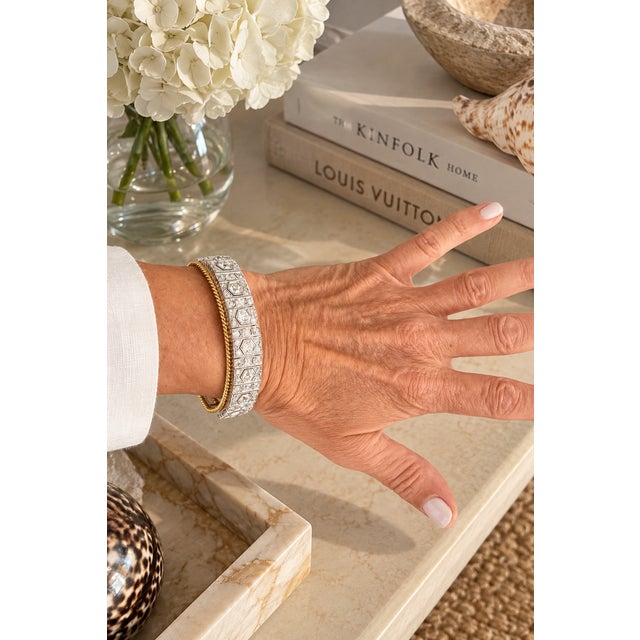 An exceptional Art Deco bracelet from circa 1930, crafted in platinum and 18K yellow gold and set with 59 diamonds...