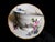 This is a white footed Haviland teacup with a pink rose and greenery. There is a large floral design on the front of the...
