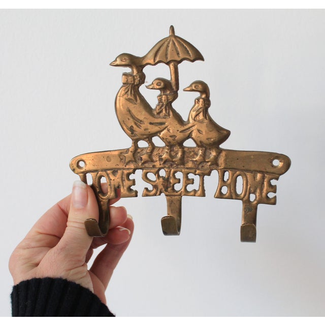 Vintage "Home Sweet Home" brass geese wall hey holder. Marked "Made in India" on the back. Three hooks. Hardware not...