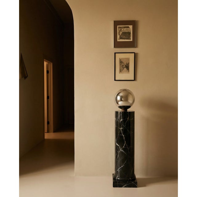 Bold, dramatic, and undeniably chic — this hand-painted wood display column commands a room with its high-gloss black...