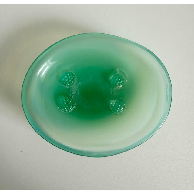 Mid 20th century soap dish made of Murano style blown glass. Features four glass rosettes in the well, allowing the bar of...