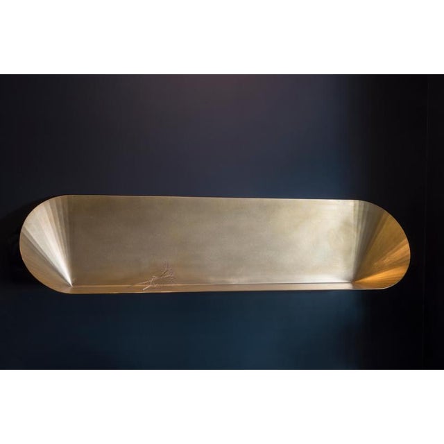 Coquillage Shelf in Brass by Julien Vidame. Dimensions: W 158 x D 20 x H 35 cm. Materials: Brass. Coquillage is a poetic...