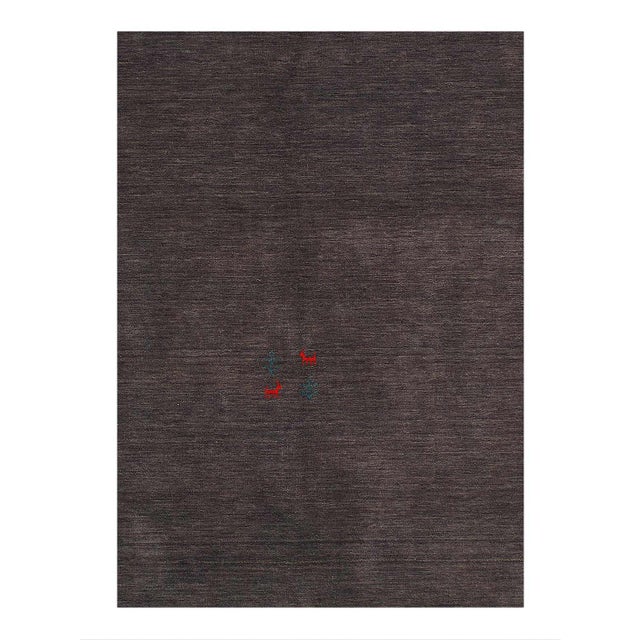 Gabbeh Rugs feature hand-spun wool in both the pile and foundation. These rugs are characterized by their abstract designs...