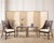 A stylish and iconic pair of rattan and cane dining armchairs designed by Barbara Barry for McGuire, San Francisco, CA....