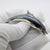 This vintage silver decorative object depicts a dolphin figurine, crafted as a vitrine centerpiece, desk sculpture, or...
