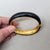 1990s Vintage Signed Napier Goldtone Black Enamel & Clear Rhinestone Cuff Bracelet For Sale - Image 5 of 11