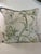 a beautifully tailored linen pillow featuring an elegant botanical print of painterly florals, leafy branches, and subtle...