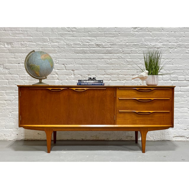 Mid Century Modern Teak Credenza / Media Stand designed by Tom Robertson and manufactured by A.H. McIntosh of Kirkcaldy,...