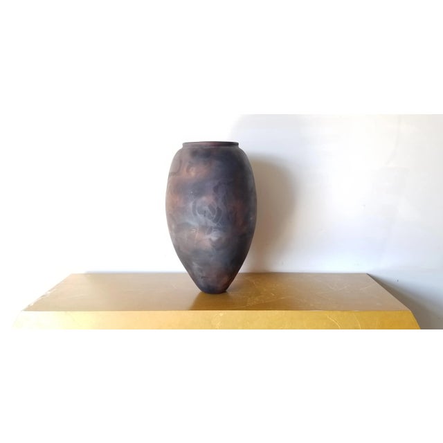 We offer you at this time this beautiful Vintage art Pottery Vase , hand thrown, Raku vase. Many slightly iridescent earth...