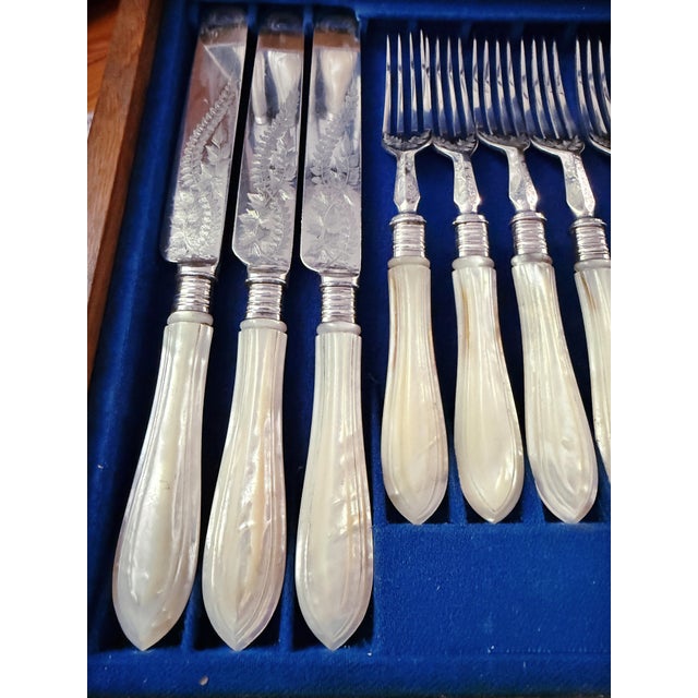 A beautiful antique circa 1890-1910s dessert or luncheon flatware service for 12 in its original case. The flatware...