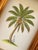 Hand-painted by master artists using acrylic paints and natural pigments, this coconut palm painting combines olive and...
