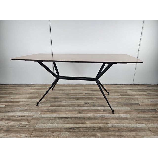 Vintage dining table with iron structure and formica top, ideal for a modern or vintage style room. Note the particular...