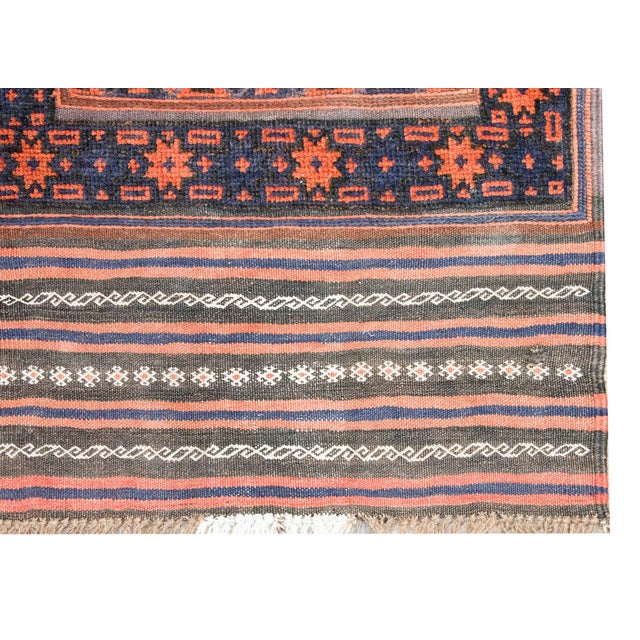 A wonderful mid 20th century Persian Afghani Baluch runner covered with diamonds all over the field and arranged into...