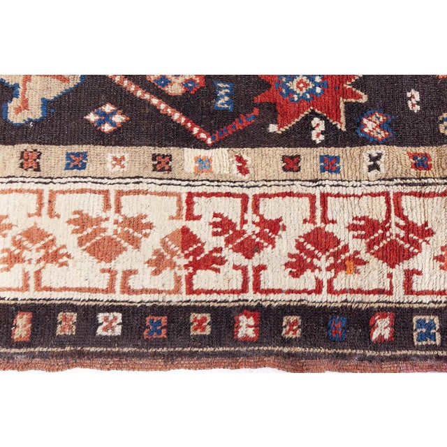 This exquisite 19th-century Karabagh runner rug embodies the rich textile heritage of the Caucasus region with striking...