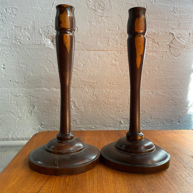Crafted from solid rosewood, this pair of mid-century modern candle holders features an elegant, elongated turned wood...