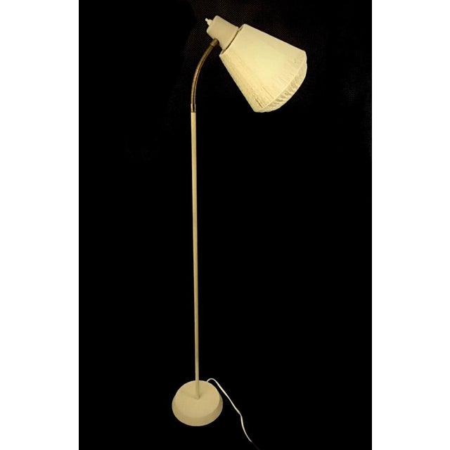 Beautiful, vintage floor lamp made by Boréns. A sophisticated lamp with a spun-thread shade that creates a delicate play...
