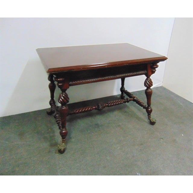 Merklin Victorian Center table or Library Table . Made of solid Mahogany, spiral twist carved legs , bronze gargoyle heads...