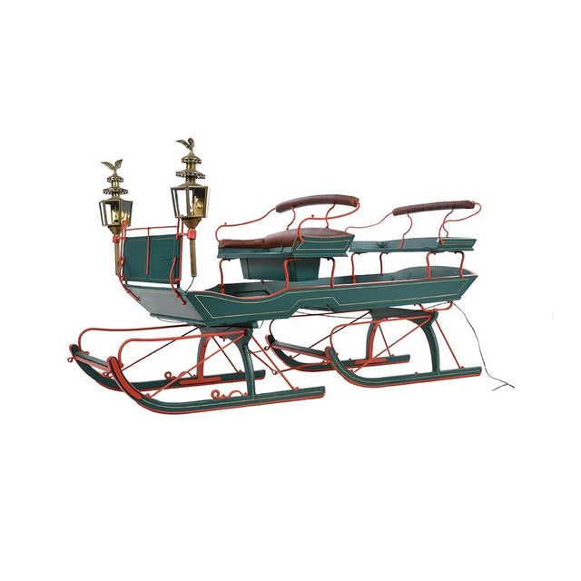 Large restored sledge in wood, brass and iron. This piece is designed in the style of the selected designer and/or...