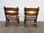 A pair of solid oak low lounge chairs by Dittmann & Co, Europe, 1960s. The defining feature is the double wave-cut back...