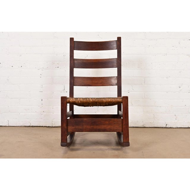 A gorgeous antique Mission or Arts & Crafts period ladder back rocking chair By Gustav Stickley USA, Circa 1910 Solid...
