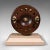 This is an antique mounted fishing reel. An English, mahogany and brass reel of sporting decorative interest and mounted...