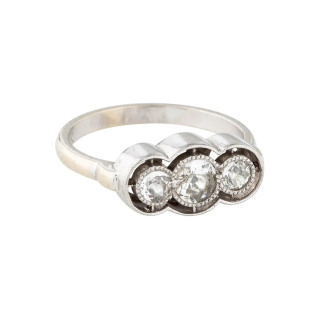 Antique estate 14K white gold pinky band ring featuring 3 old European cut round diamonds totaling 0.4 carats. This...