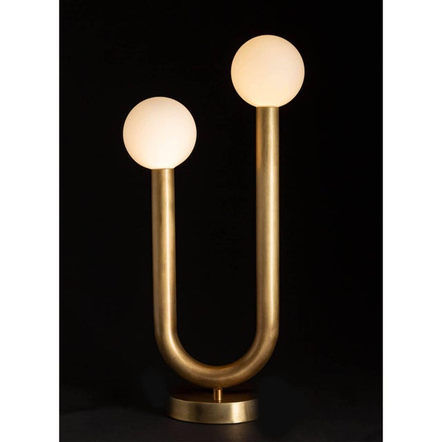 The Happy Table Lamp is a unique mix of modern and playful. Happy's simple, asymmetrical charm creates uplifting...