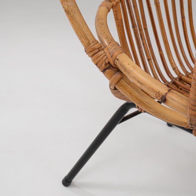 Pair of 1960s French Bamboo Lounge Chairs. This pair of mid-century French lounge chairs showcases the lightness and...