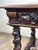 Louis XIII style oak desk with turned legs and twisted baluster columns connected by crossbars and decorated with...