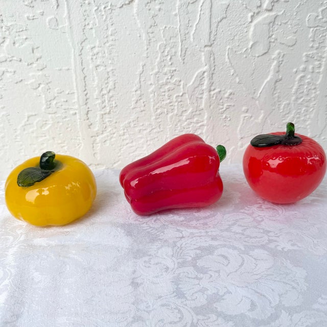 A vibrant set of three vintage hand-blown art glass vegetables in the style of Fratelli Toso or Alfredo Barbini, featuring...
