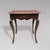 A Louis XV period oak side table with a drawer in the front. It rests on cabriole legs. The tabletop has a faux marble...