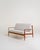 Teak sofa with removable cushions, recently reupholstered in a light cotton blend. Frame with distinctive metal back...
