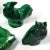 A collection of figurines made by hand from polished malachite. The figurines have damage, losses and old repairs. Six...