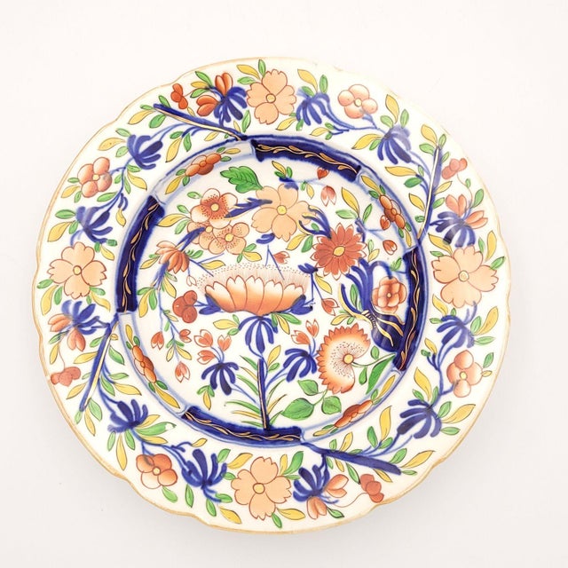 A set of ten (plus two extra, one with rim chip and one with hairlines) Coalport soup bowls, England circa 1830.