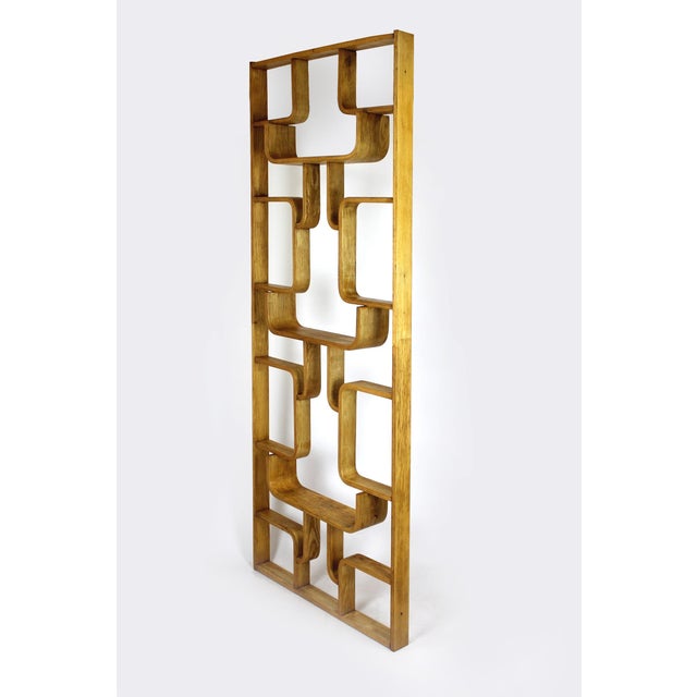 A bent-plywood divider by Ludvik Volak with his characteristic geometric layout, finished with an ash veneer. The piece is...