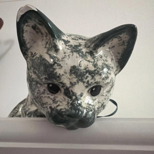 This product is a cute mottled green ceramic cat figurine, perfect for cat lovers or collectors of animal figurines. The...