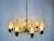 An Italian midcentury chandelier made in the 1960s, style of Stilnovo. It is fascinating with its monumental design and 10...