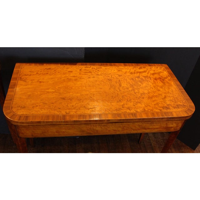 Circa 1790 pair of satinwood games tables, George III, English. Raised on square, tapered legs. Crossbanded & line inlaid...