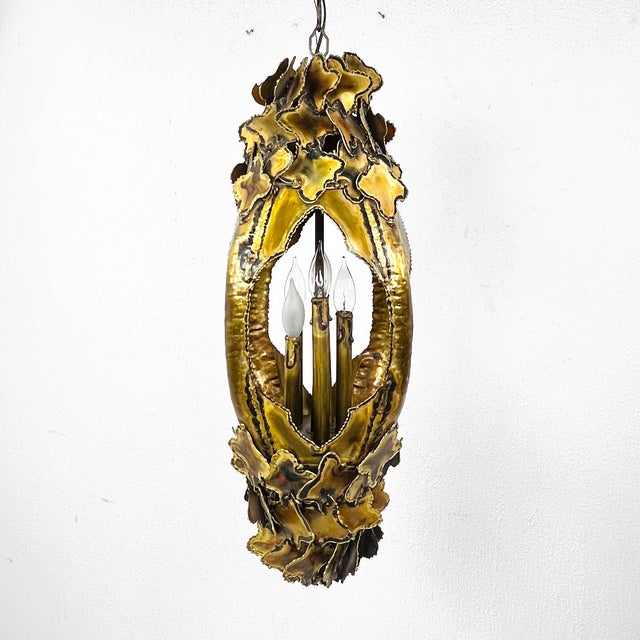This torch cut brutalist chandelier was designed by Tom Greene and made by Feldman Lighting of Los Angeles. Its long...