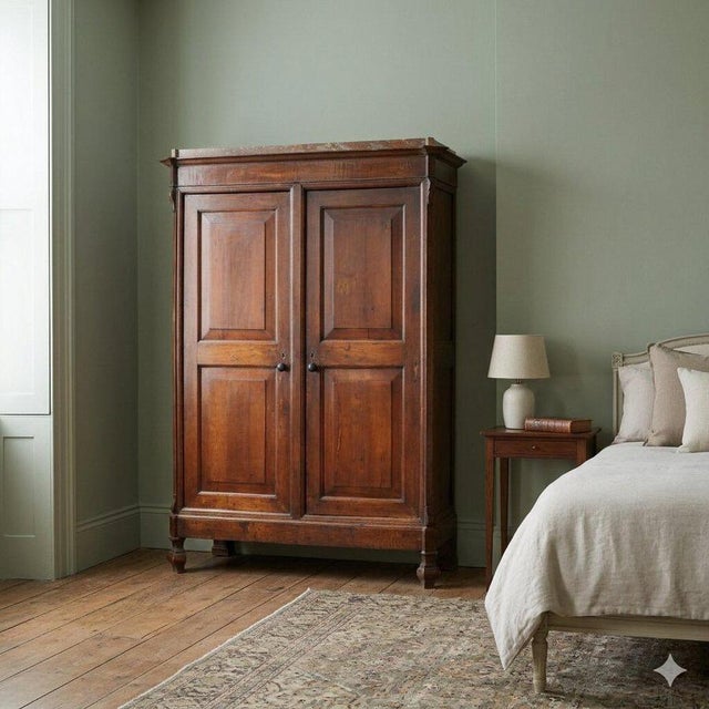 Walnut wardrobe. Front with two doors and a dividing upright, interior with two compartments and poplar shelves, matching...